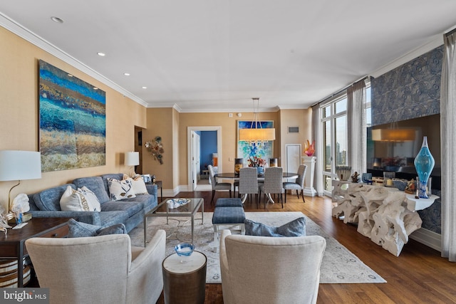 living room featuring dark hardwood / wood-style flooring and ornamental molding