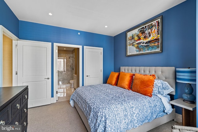 carpeted bedroom featuring connected bathroom