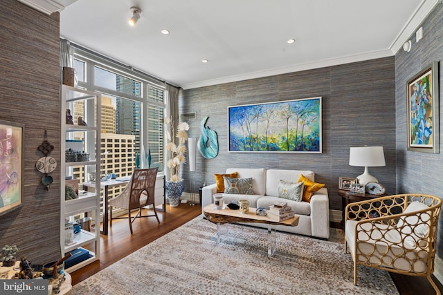 living room with hardwood / wood-style floors and ornamental molding