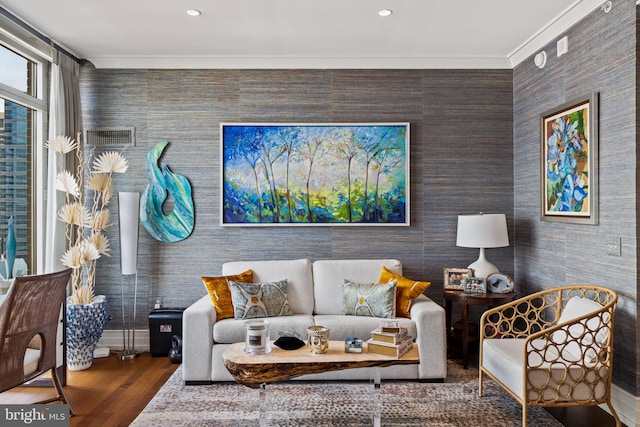 living room featuring hardwood / wood-style flooring and ornamental molding