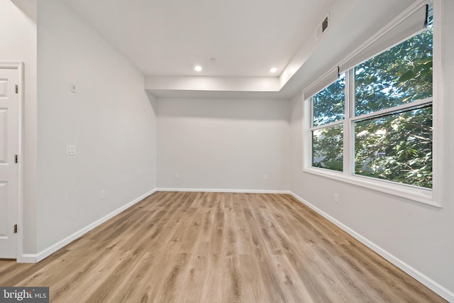 unfurnished room featuring light hardwood / wood-style floors