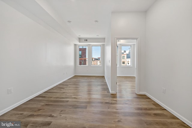 empty room featuring wood-type flooring