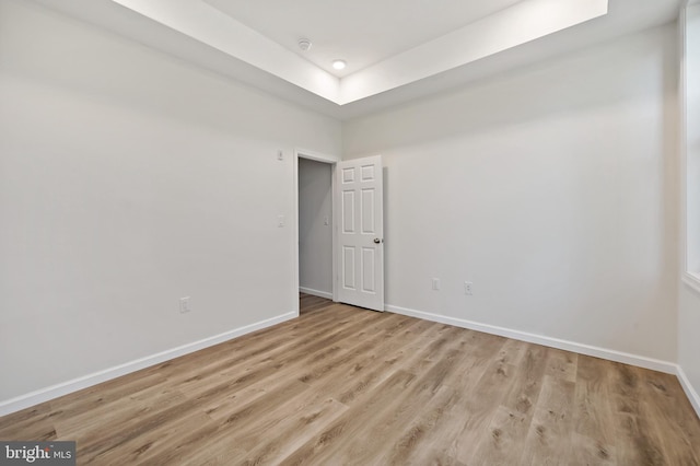 unfurnished room with light wood-type flooring