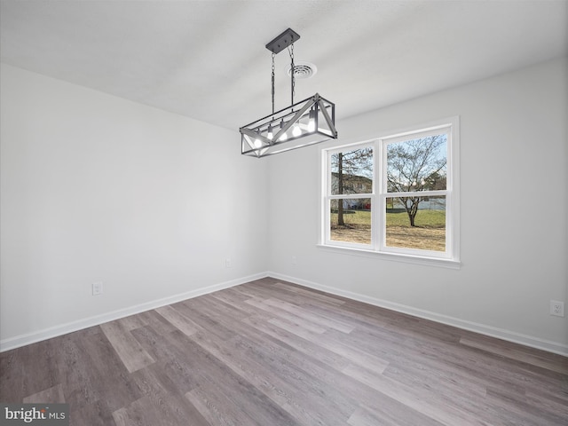 unfurnished dining area with hardwood / wood-style flooring