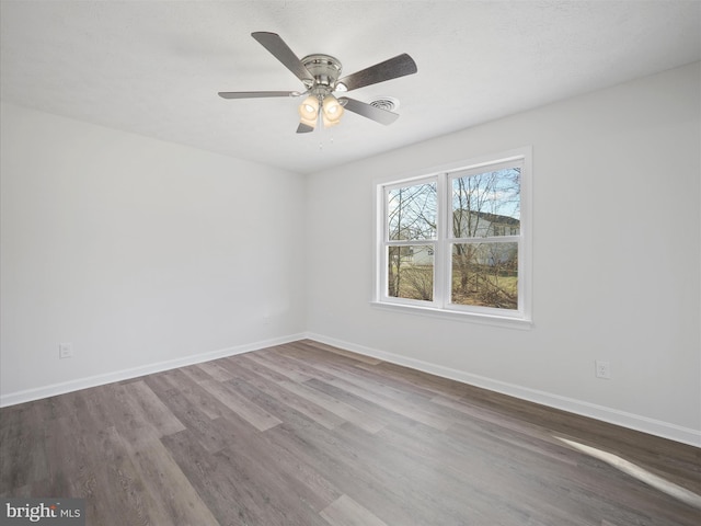 unfurnished room with wood-type flooring and ceiling fan