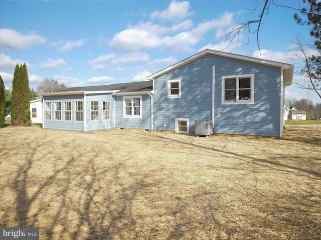 rear view of house with central air condition unit