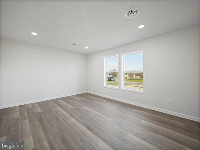 empty room featuring wood-type flooring