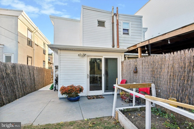 back of property featuring a patio area