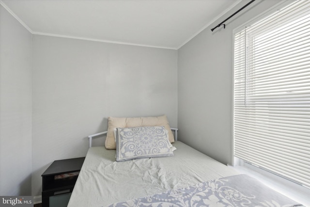 bedroom with ornamental molding