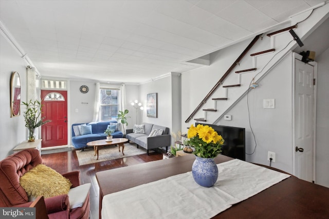 living room featuring ornamental molding and hardwood / wood-style floors