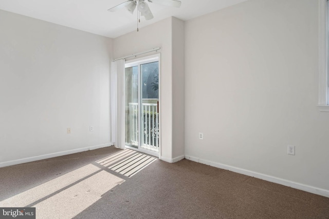 empty room featuring carpet floors and ceiling fan