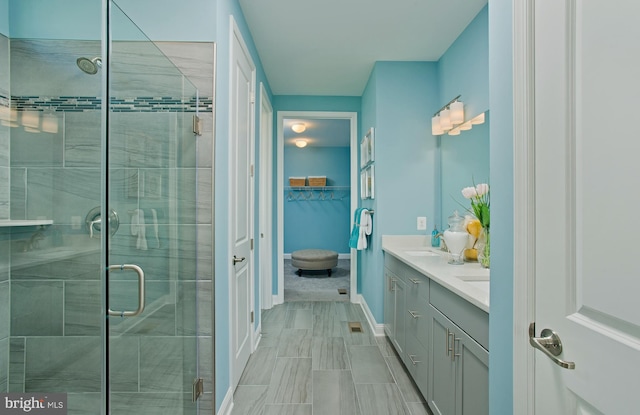 bathroom with vanity and an enclosed shower