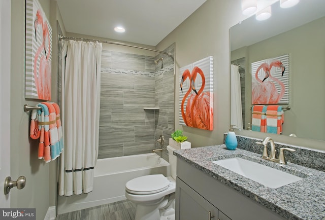 full bathroom featuring vanity, toilet, and shower / tub combo