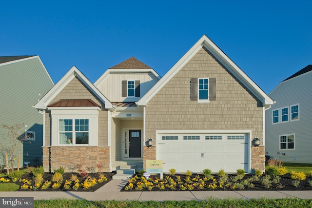 craftsman house with a garage