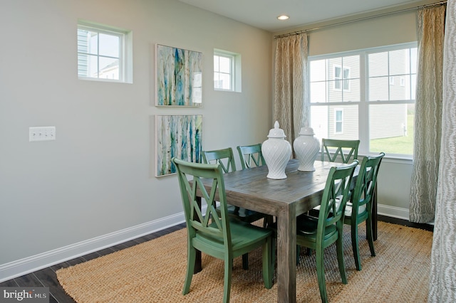 dining area with hardwood / wood-style floors and a wealth of natural light