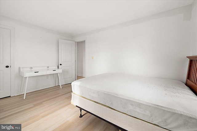 bedroom featuring wood-type flooring