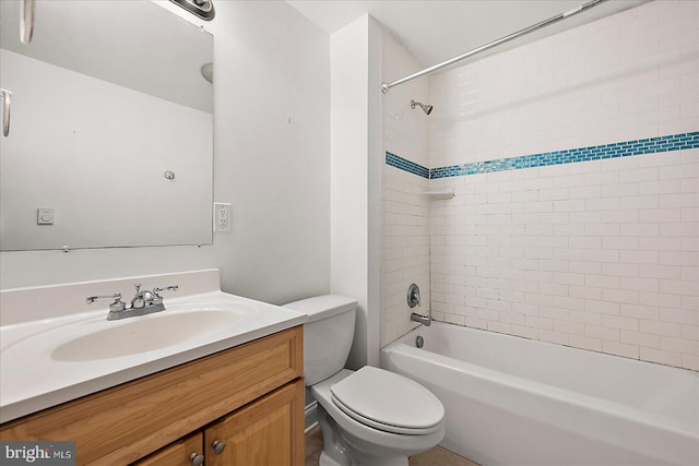 full bathroom featuring vanity, toilet, and tiled shower / bath combo