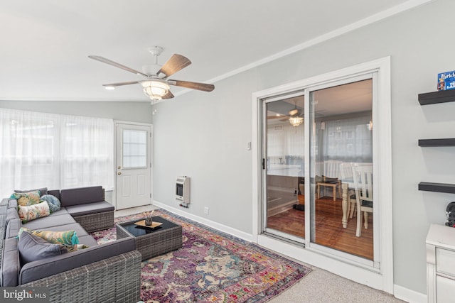 carpeted living room with heating unit, ceiling fan, and vaulted ceiling