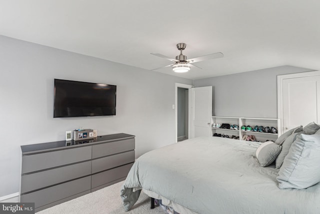 bedroom with carpet flooring, ceiling fan, and lofted ceiling