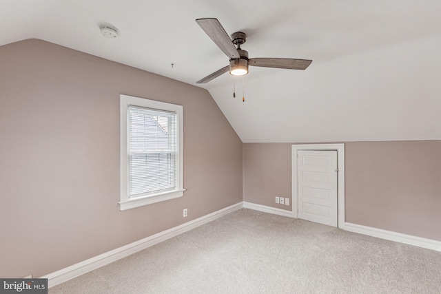 additional living space featuring carpet, ceiling fan, and lofted ceiling