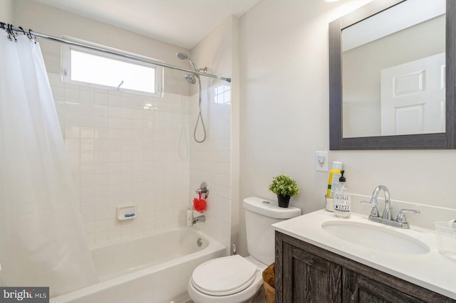 full bathroom featuring toilet, vanity, and shower / bath combo with shower curtain