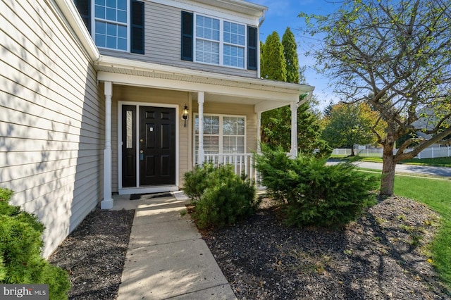 doorway to property featuring a porch