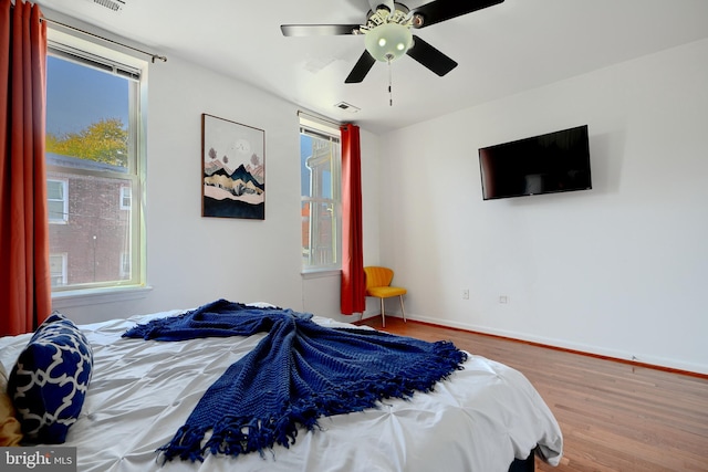 bedroom featuring ceiling fan and wood-type flooring