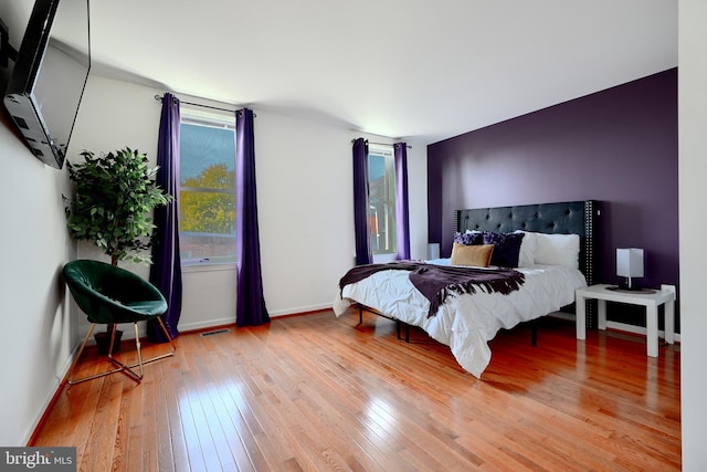 bedroom with wood-type flooring