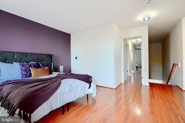 bedroom with wood-type flooring