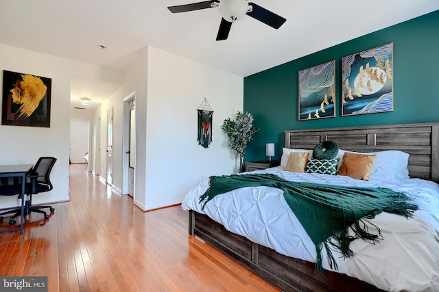 bedroom featuring hardwood / wood-style flooring and ceiling fan