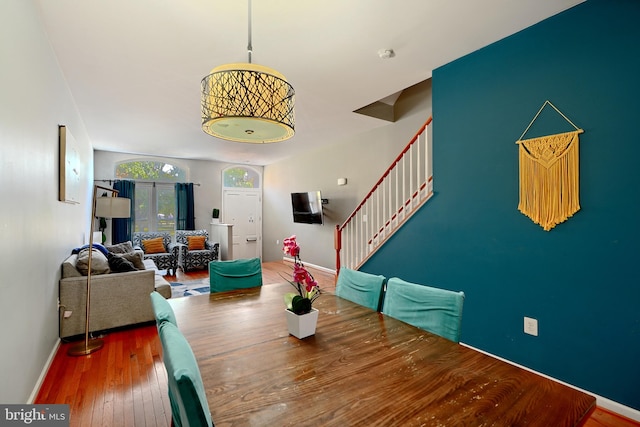 dining space with hardwood / wood-style flooring