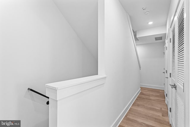 spacious closet featuring light hardwood / wood-style floors