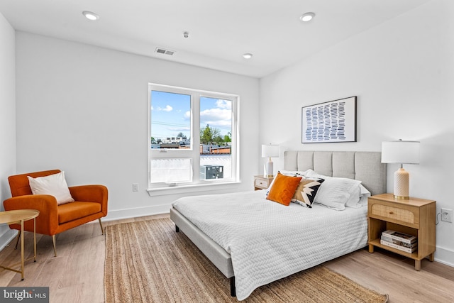 bedroom with wood-type flooring