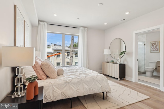 3205 N 35th St Unit 5, Philadelphia, PA 19129 - bedroom featuring light wood finished floors, radiator heating unit, baseboards, recessed lighting, and connected bathroom