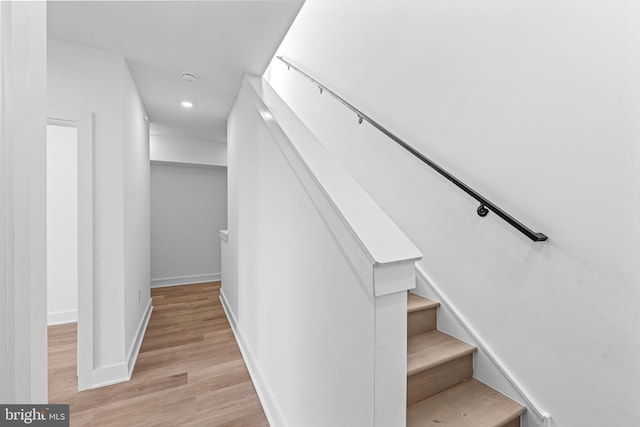 stairway featuring hardwood / wood-style flooring