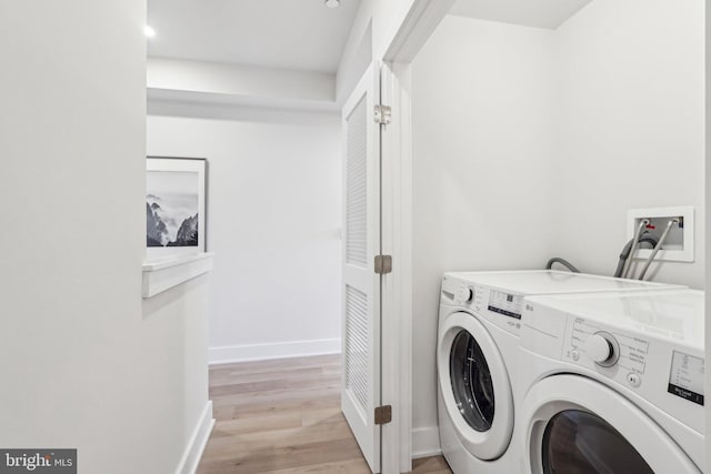 3205 N 35th St Unit 5, Philadelphia, PA 19129 - washroom featuring washing machine and clothes dryer, light wood finished floors, baseboards, and recessed lighting