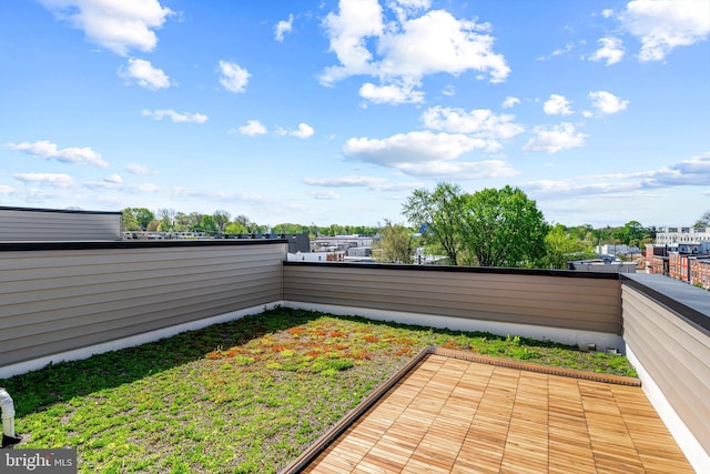 view of patio featuring a balcony