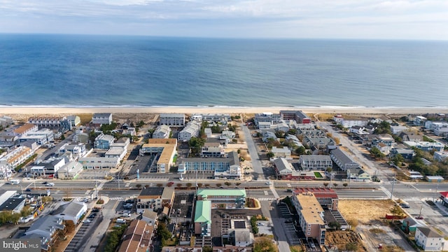 aerial view featuring a view of the beach and a water view