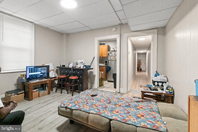 office area featuring light hardwood / wood-style floors and a paneled ceiling