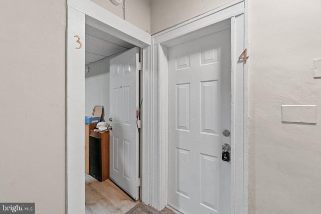 corridor featuring light hardwood / wood-style floors