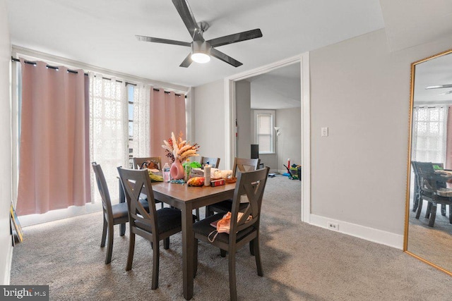 dining room featuring ceiling fan and carpet flooring