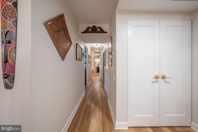 hall with light wood-type flooring