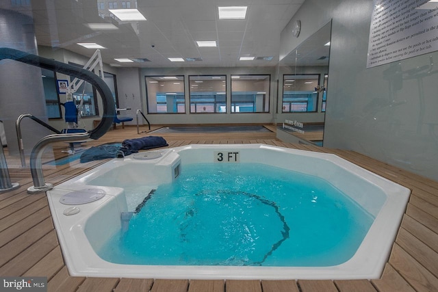 view of pool featuring a jacuzzi