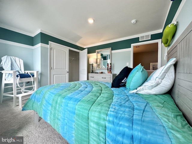 carpeted bedroom with a closet and ornamental molding