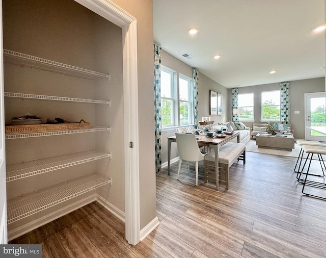 dining space featuring light wood-type flooring