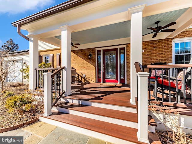 doorway to property featuring ceiling fan and a porch