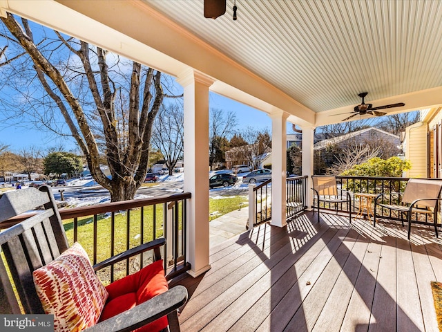 deck with covered porch and ceiling fan