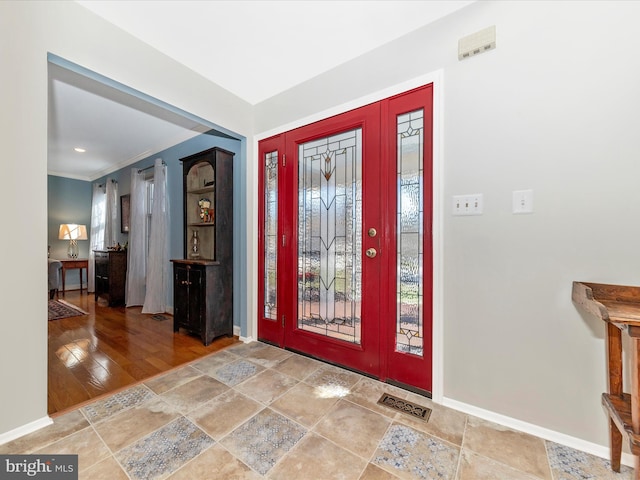 entryway featuring ornamental molding