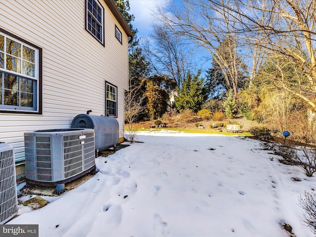 yard covered in snow with cooling unit