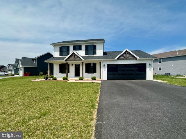 2040 Jelena Rd, Shippensburg, PA 17257 - modern farmhouse style home with board and batten siding, asphalt driveway, a garage, a front yard, and a porch